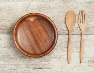 Wooden dish and spoon set on wooden background,Top view