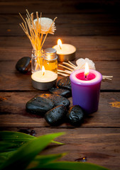 Obraz na płótnie Canvas zen basalt stones, lavender candles on wooden,dark background,,S