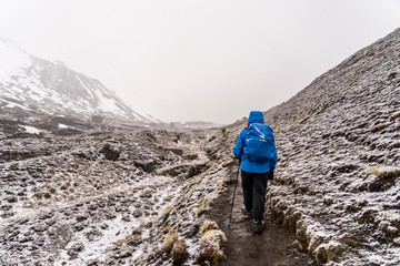 Fototapeta premium trekking under snow so hard and difficult to beat