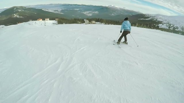 Woman Ski descent in nature