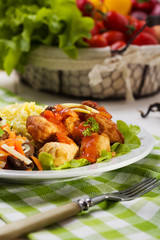 Fried chicken pieces in batter with sweet and sour sauce