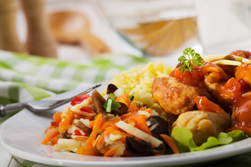 Fried chicken pieces in batter with sweet and sour sauce