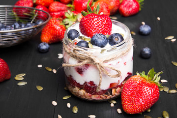 delicious dessert - yogurt with strawberries and blueberries