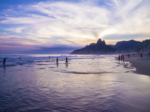 Dusk sunset scenic view of Ipanema Beach with Two Brothers Dois Irmaos Mountain of the Rio de Janeiro, Brazil city skyline 