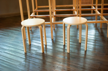 wooden chair on laminate flooring in the room
