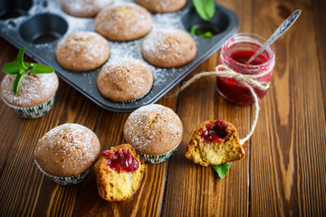 sweet baked muffins with jam inside