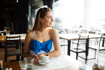 Stunning woman enjoying her coffee