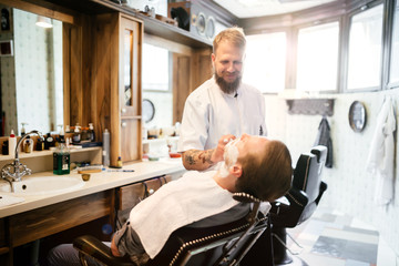 Male receiving hair beard treatment