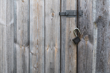 Old wooden door with metal lock