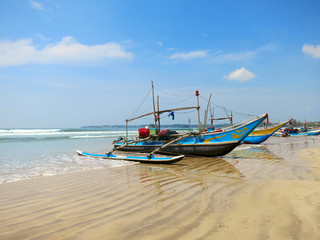 Naklejka na ściany i meble Sri Lankan fishing boats at the beach in Weligama