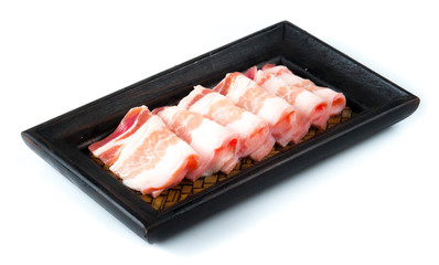 Pork belly sliced on wood plate