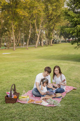 happy asian family in nature ,Beautiful family portrait ,Happy Asian Family In Garden