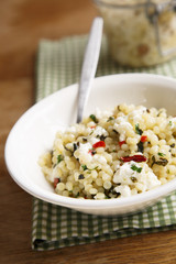 Israeli couscous with feta cheese, herbs and chili
