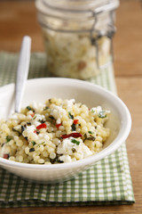 Israeli couscous with feta cheese, herbs and chili