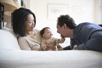 Family playing on sofa