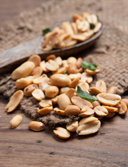 Roasted Peanuts and herb on wood