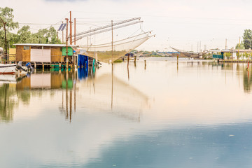 fishing huts in the quiet of brackish lagoon