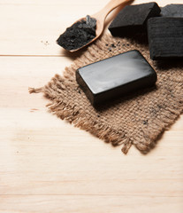 block of natural carbon soap and Black charcoal