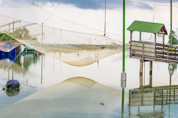 fishing huts in the quiet of brackish lagoon