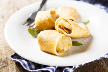 Pancakes with baked apple filling