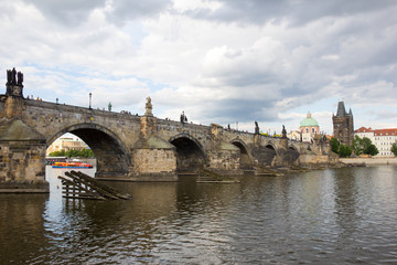 Fototapeta na wymiar Charles Bridge And Old Bridge Tower At River Vltava In Prague Czech Republic