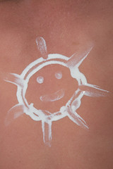 Sun-shaped sun cream symbol of happiness