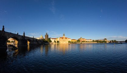 Charles Bridge Across River Vltava In Prague At Sunset
