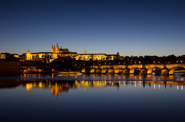 View To Hradschin Castle, St. Vitus Cathedral And Charles Bridge In Prague By Night 