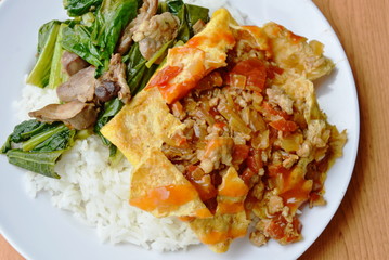 stuffed omelet and stir fried Chinese cabbage with chicken entrails on rice