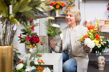 Mature female customer in floral shop.