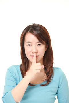 middle aged Japanese woman whith silence gestures