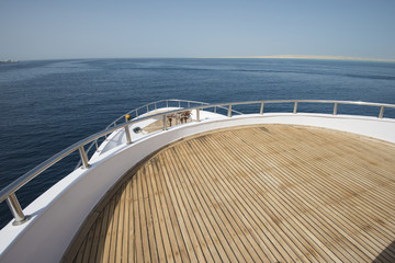 Naklejka na ściany i meble View over the bow over a large motor yacht