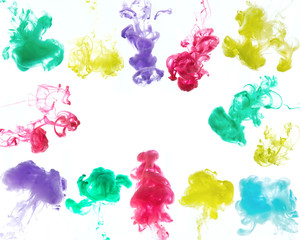 The clouds of colorful ink on the white