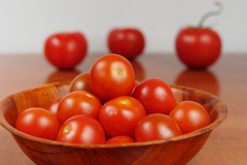 Cherry tomatoes in a wooden bowl