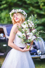 Wedding . Beautiful bride. Love.Beautiful bride with a wreath on his head holding a bouquet. bride.