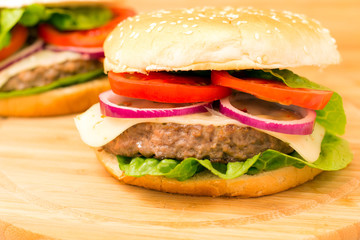 Fresh burger closeup on wooden table