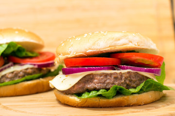 Fresh burger closeup on wooden table