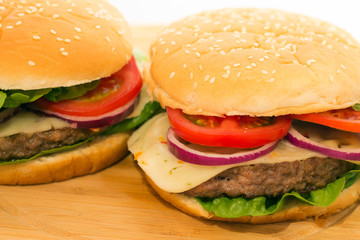 Fresh burger closeup on wooden table