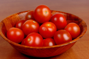 Cherry tomatoes in a wooden bowl