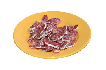 Dish with sliced smoked sausages isolated on white background