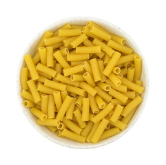 Large bowl filled with rigatoni pasta top view isolated on a white background.