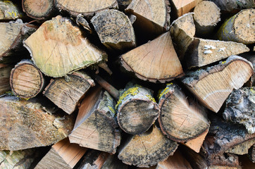 Fototapeta premium Natural wooden background - closeup of chopped firewood