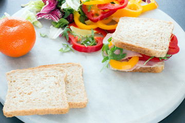 Healthy lunch food sandwich with turkey and ham on a plate
