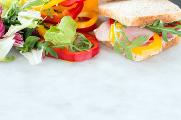 Healthy lunch food sandwich with turkey and ham on a plate