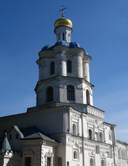 Fototapeta na wymiar Old Christian chapel over blue sky 