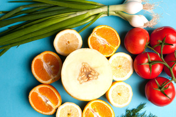 Healthy vegetables and fruits on a blue background