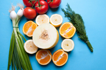 Healthy vegetables and fruits on a blue background