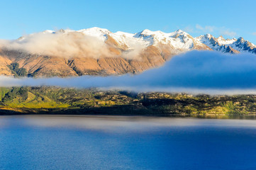 Fototapeta na wymiar Clouds over the lake in Glenorchy, New Zealand