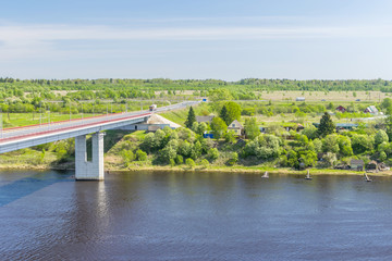 Fototapeta premium The bridge across the Volkhov river near the village Semenkovo, St. Petersburg, Russia, Leningrad region