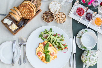 Absolutely Amazing Top View of Bread, Tea, Tasty Berry Jam, Scrambled Eggs with Salad on the Table for Breakfast, Brunch Time in Restaurant, Breakfast Conception, Traditional English Tea Ceremony